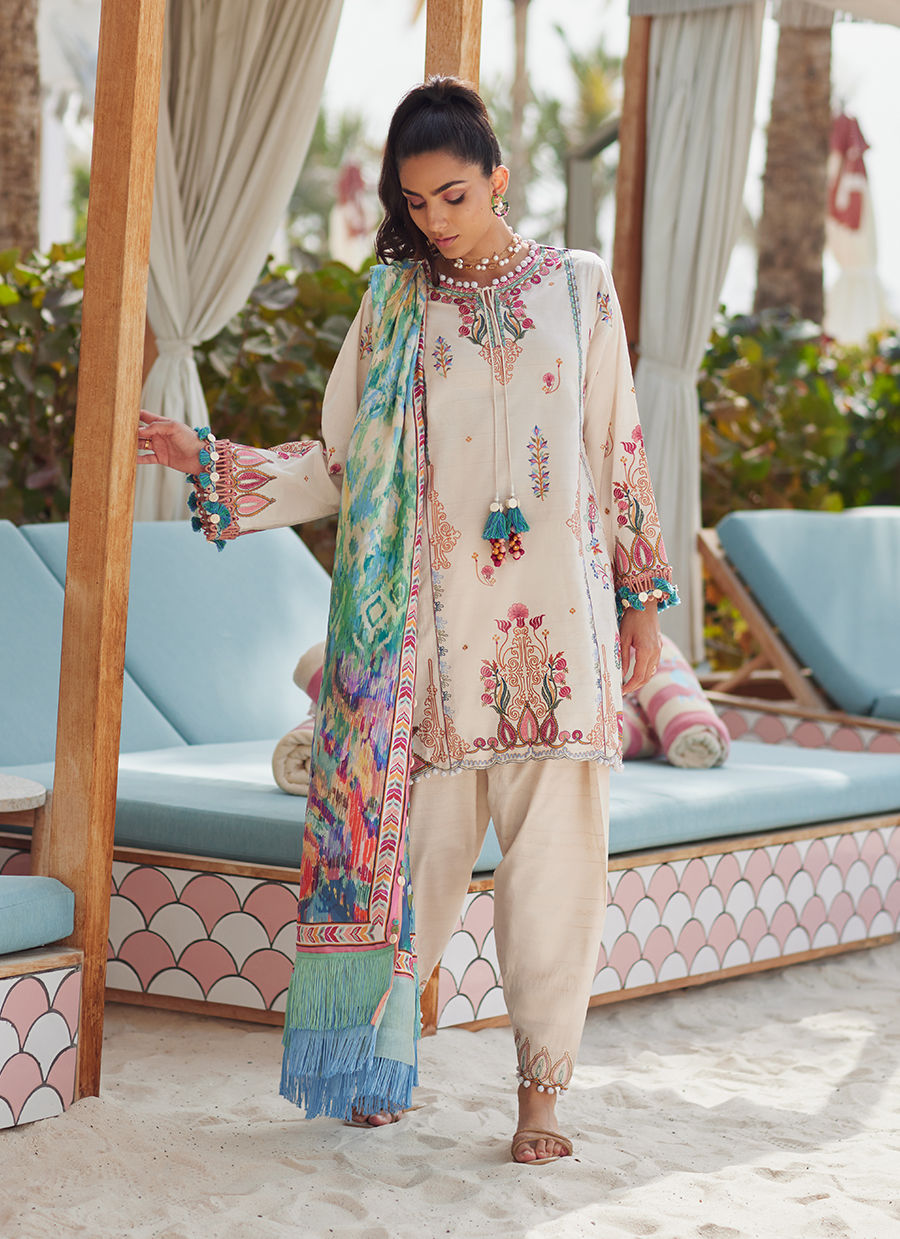 Model wearing ivory embroidered dress with multicolor printed dupatta from Farah Talib Aziz Irene Ivory, Pakistani clothes online in UK.