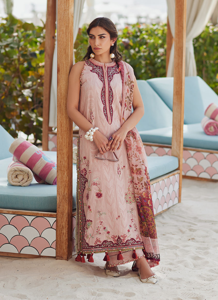 Model wearing tea pink embroidered dress with tassel detailing from Farah Talib Aziz Pricsilla, Pakistani Luxury pret in UK.