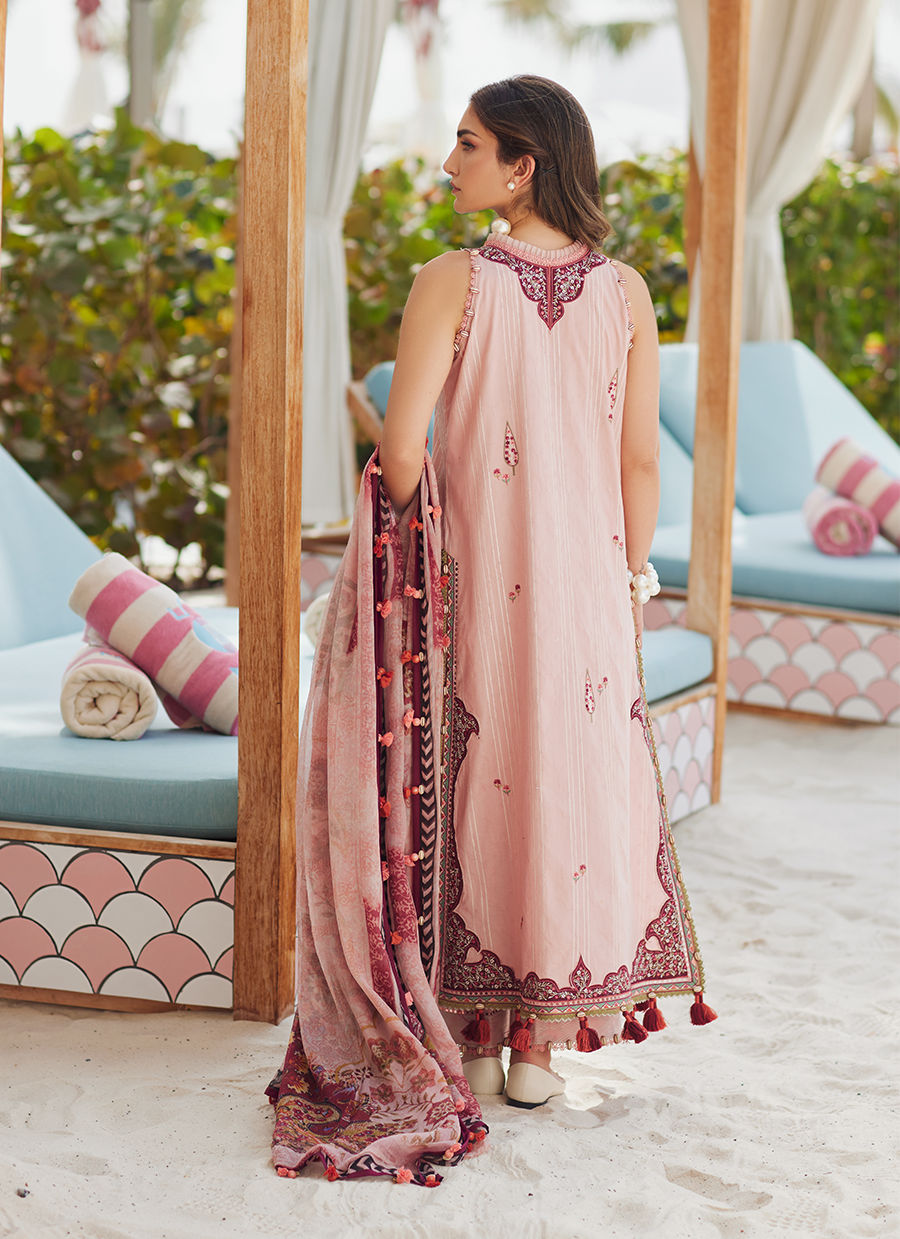 Model wearing tea pink embroidered dress with tassel detailing from Farah Talib Aziz Pricsilla, Pakistani Luxury pret in UK.