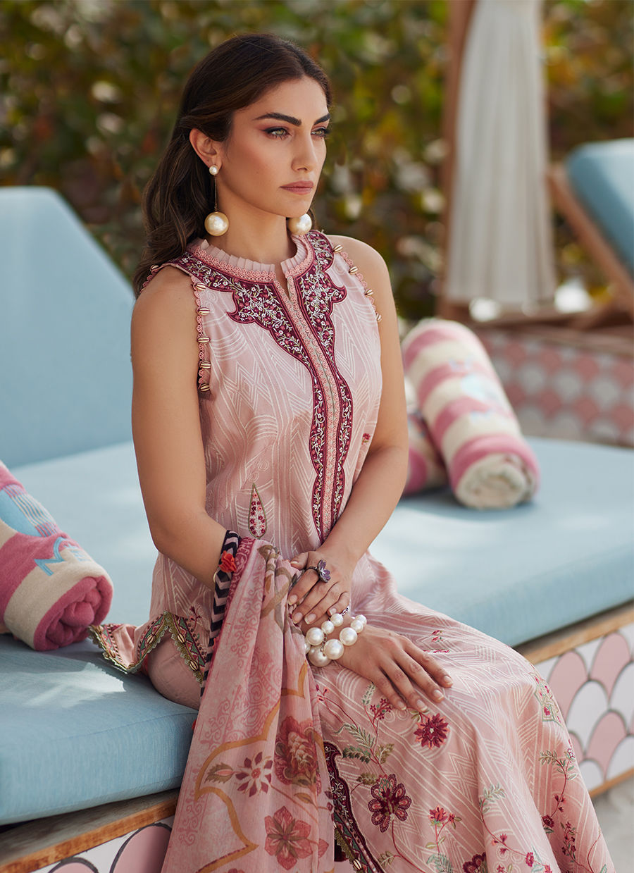 Model wearing tea pink embroidered dress with tassel detailing from Farah Talib Aziz Pricsilla, Pakistani Luxury pret in UK.