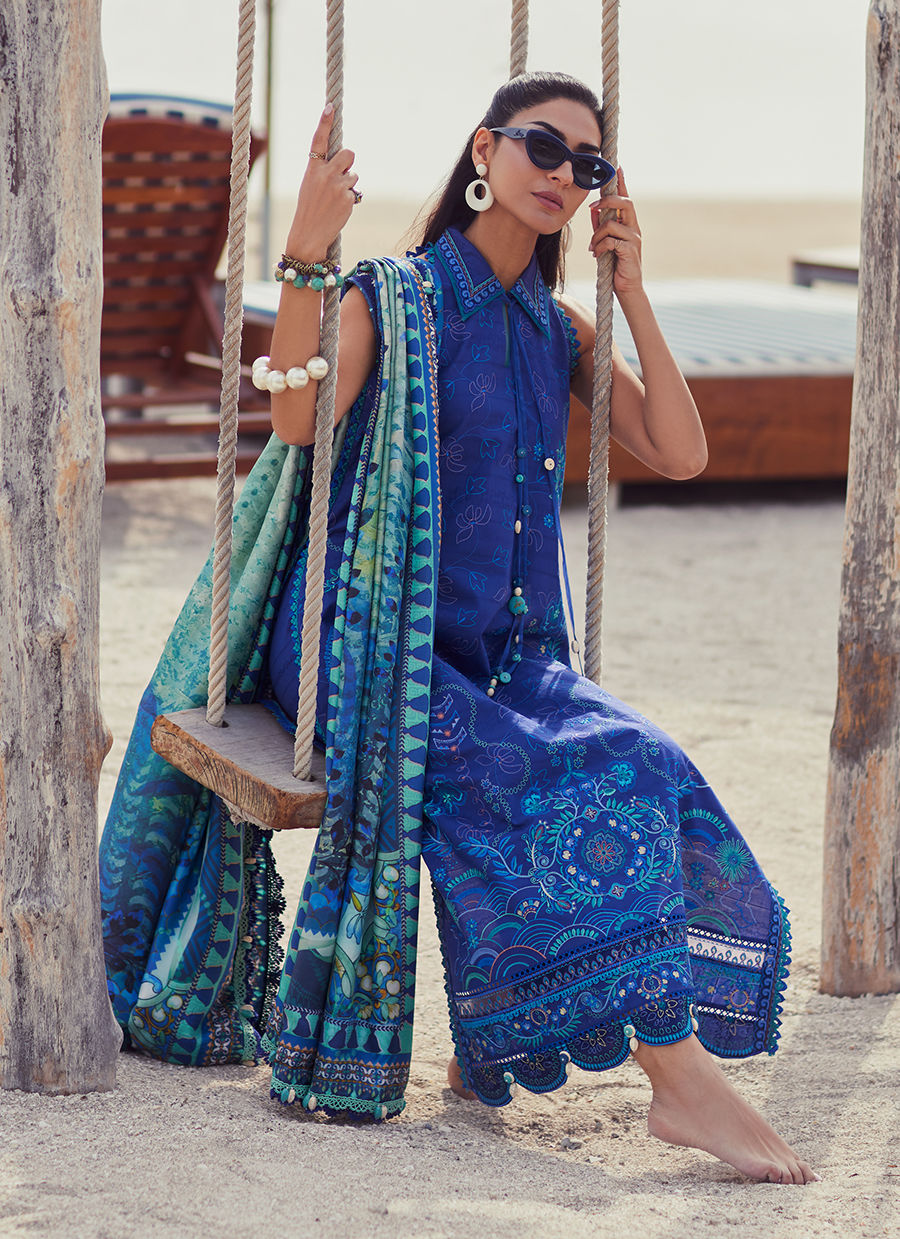 Model wearing a deep blue embroidered outfit from Farah Talib Aziz, Unstitched Luxury '25, ideal for Pakistani luxury pret lovers in UK.