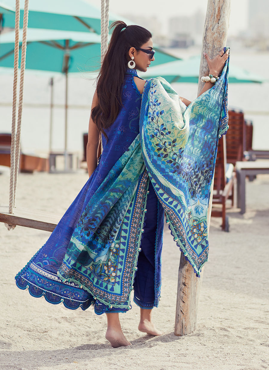Model wearing a deep blue embroidered outfit from Farah Talib Aziz, Unstitched Luxury '25, ideal for Pakistani luxury pret lovers in UK.