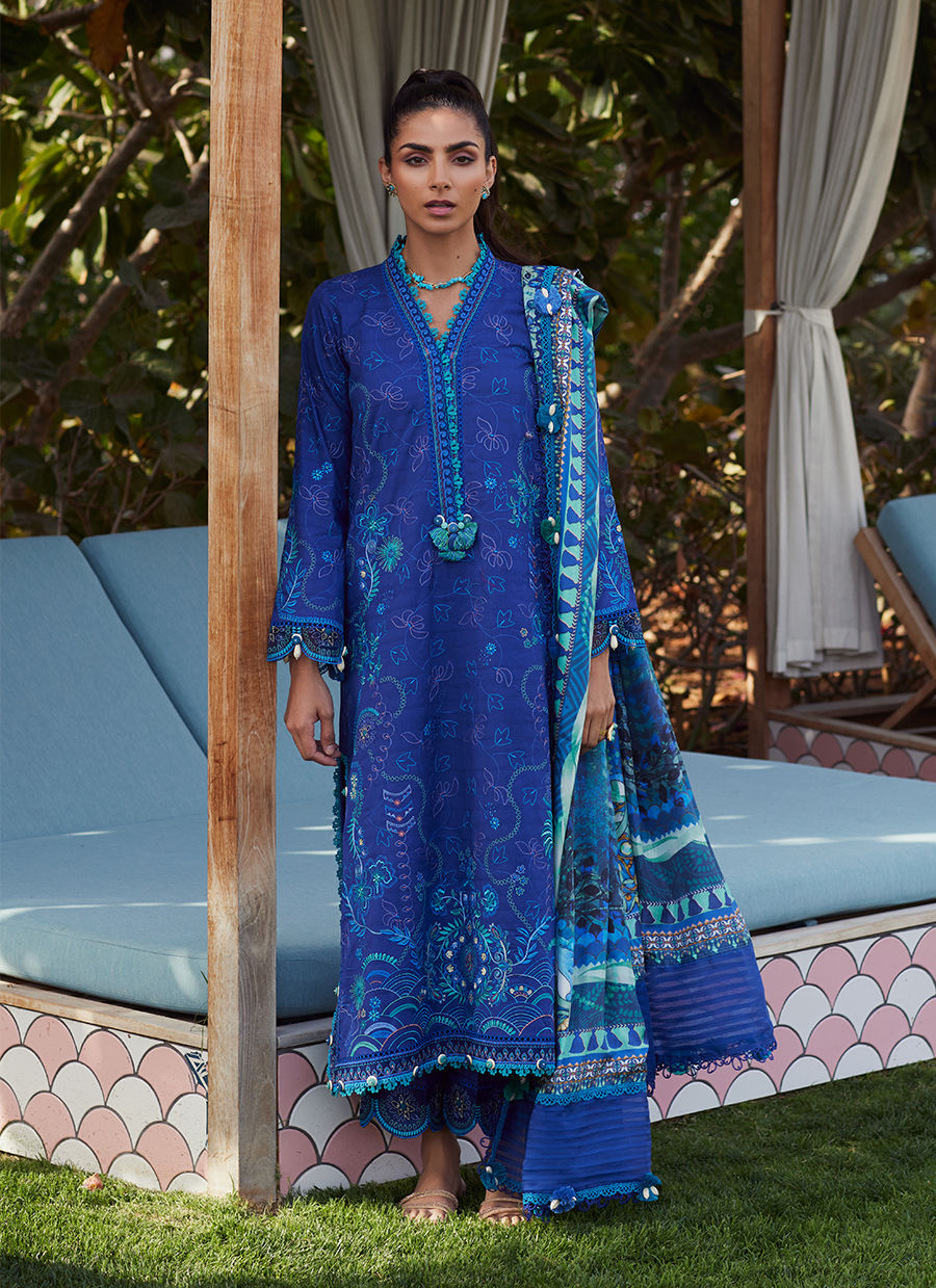 Model wearing a deep blue embroidered outfit from Farah Talib Aziz, Unstitched Luxury '25, ideal for Pakistani luxury pret lovers in UK.