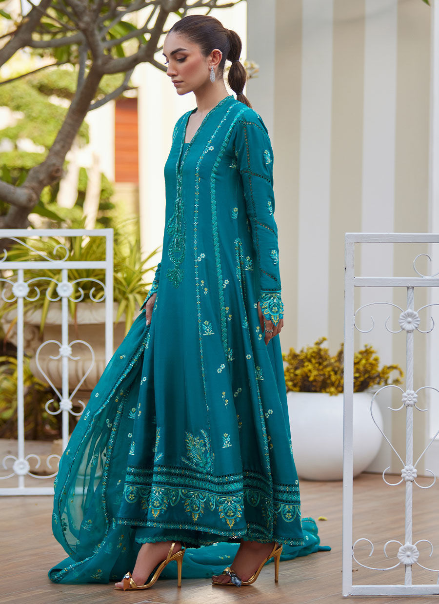 Model wearing emerald green embroidered outfit from Farah Talib Aziz, ideal for Pakistani luxury pret and Pakistani clothes online in UK.
