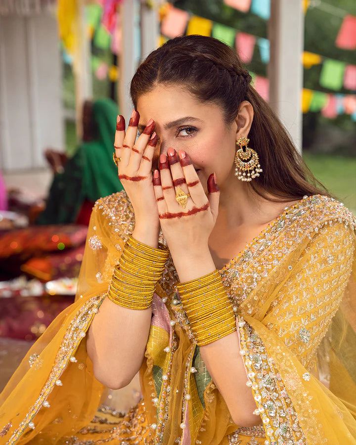 model wearing yellow dress by Faiza Saqlain, Pakistani luxury pret, ideal for online shopping in the UK