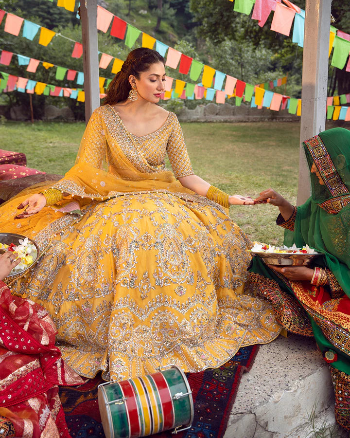 model wearing yellow dress by Faiza Saqlain, Pakistani luxury pret, ideal for online shopping in the UK