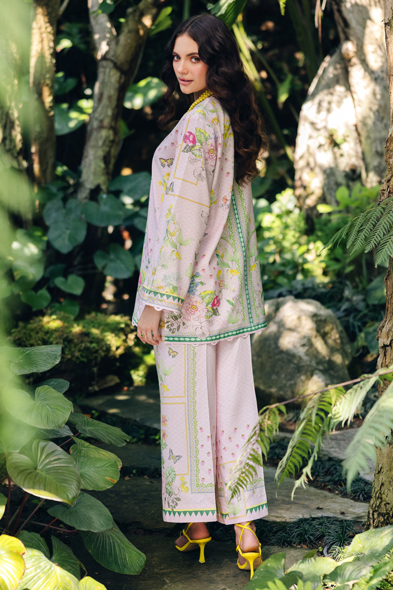 Model wearing OP-02 Elio, side angle, a Pakistani designer outfit by Qalamkar, available online in the UK.