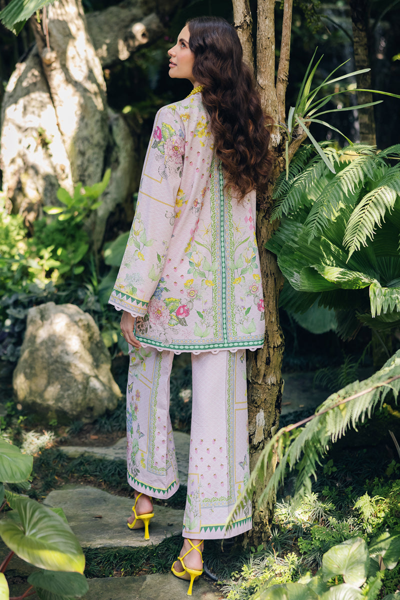 Model wearing OP-02 Elio, three-quarter view, a Pakistani designer outfit by Qalamkar, available online in the UK.