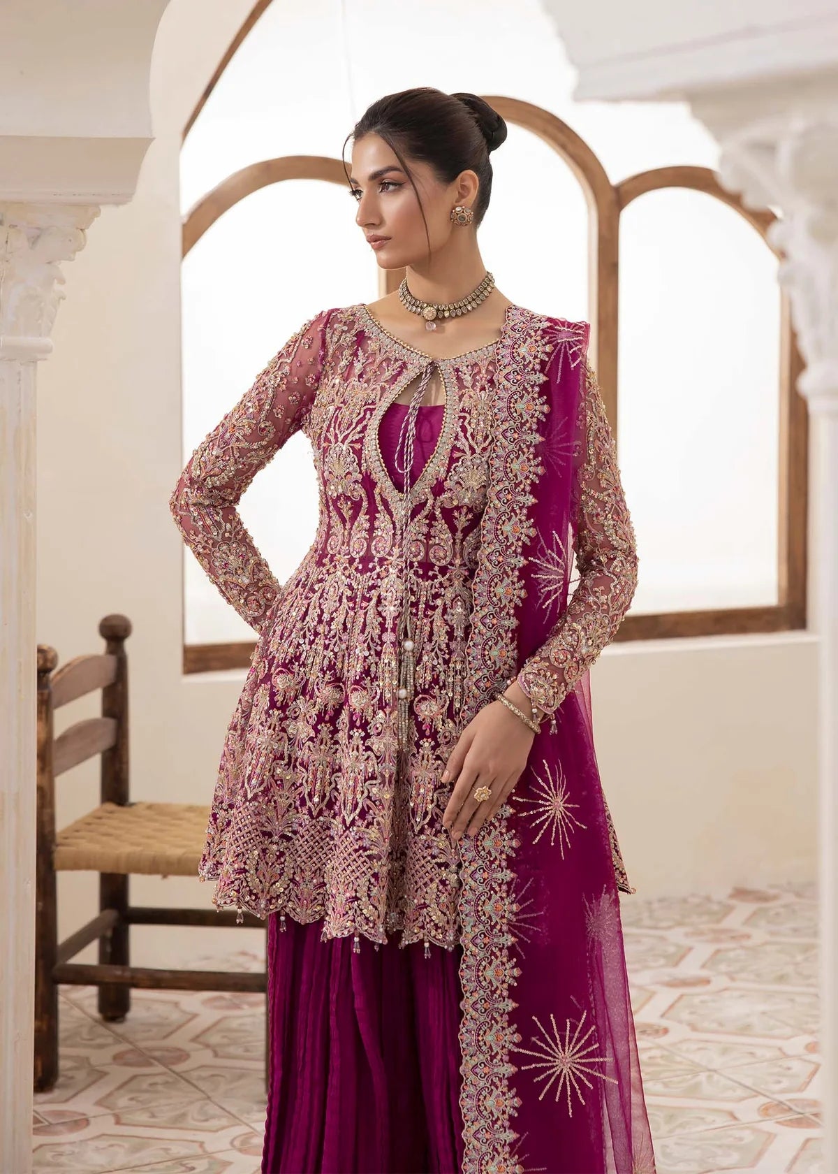 Model wearing deep magenta Kaira dress by Kanwal Malik, adorned with rich embroidery—Pakistani luxury pret available online in UK.