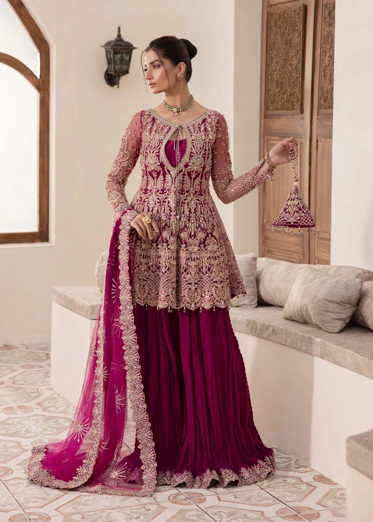 Model wearing deep magenta Kaira dress by Kanwal Malik, adorned with rich embroidery—Pakistani luxury pret available online in UK.