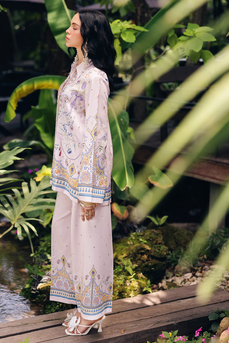 Model wearing OP-08 Ruhi, three-quarter view, a Pakistani designer outfit by Qalamkar, available online in the UK.