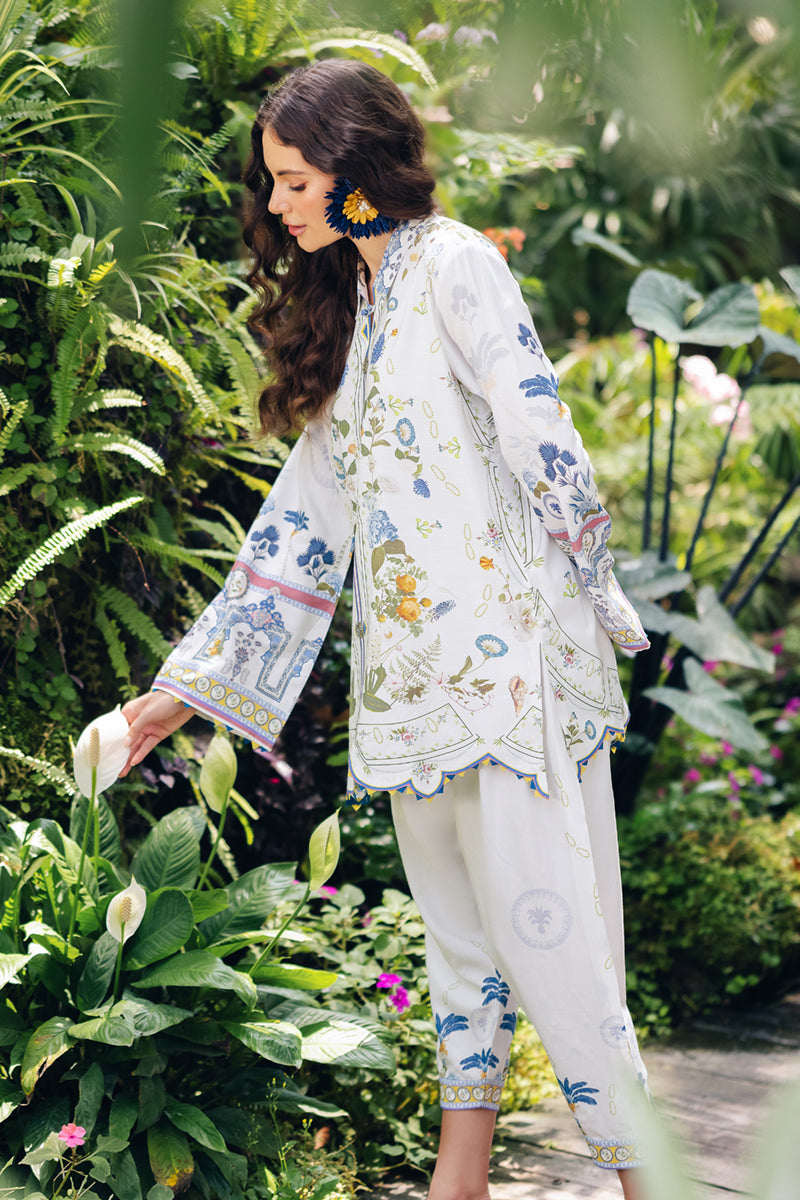 Model wearing OP-06 Ilsa, three-quarter view, a Pakistani designer outfit by Qalamkar, available online in the UK.