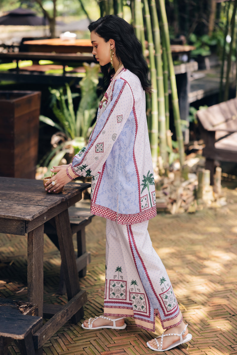 Model wearing OP-05 Rihana, three-quarter view, a Pakistani designer outfit by Qalamkar, available online in the UK.