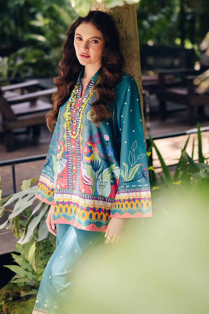 Model wearing OP-10 Liva, side angle, a Pakistani designer outfit by Qalamkar, available online in the UK.