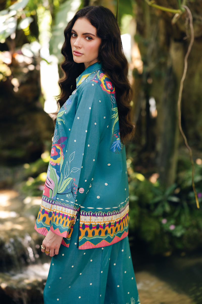 Model wearing OP-10 Liva, embroidery focus, a Pakistani designer outfit by Qalamkar, available online in the UK.