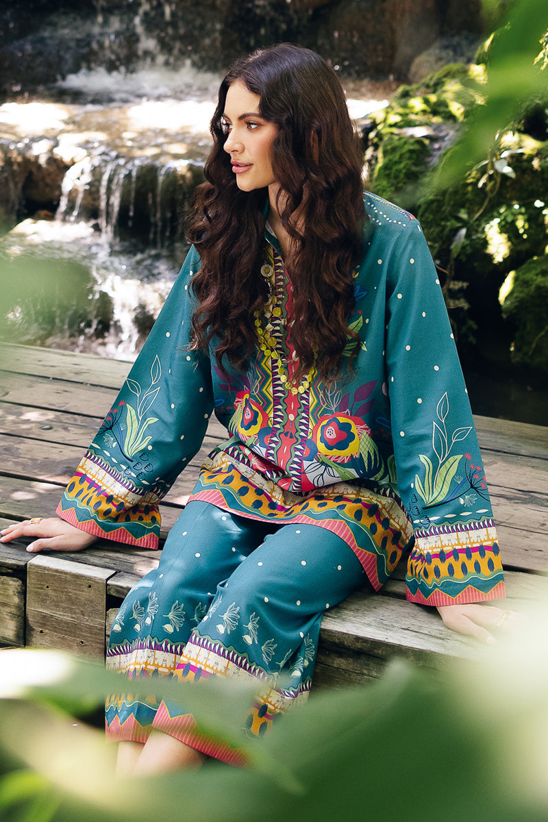 Model wearing OP-10 Liva, final angle shot, a Pakistani designer outfit by Qalamkar, available online in the UK.