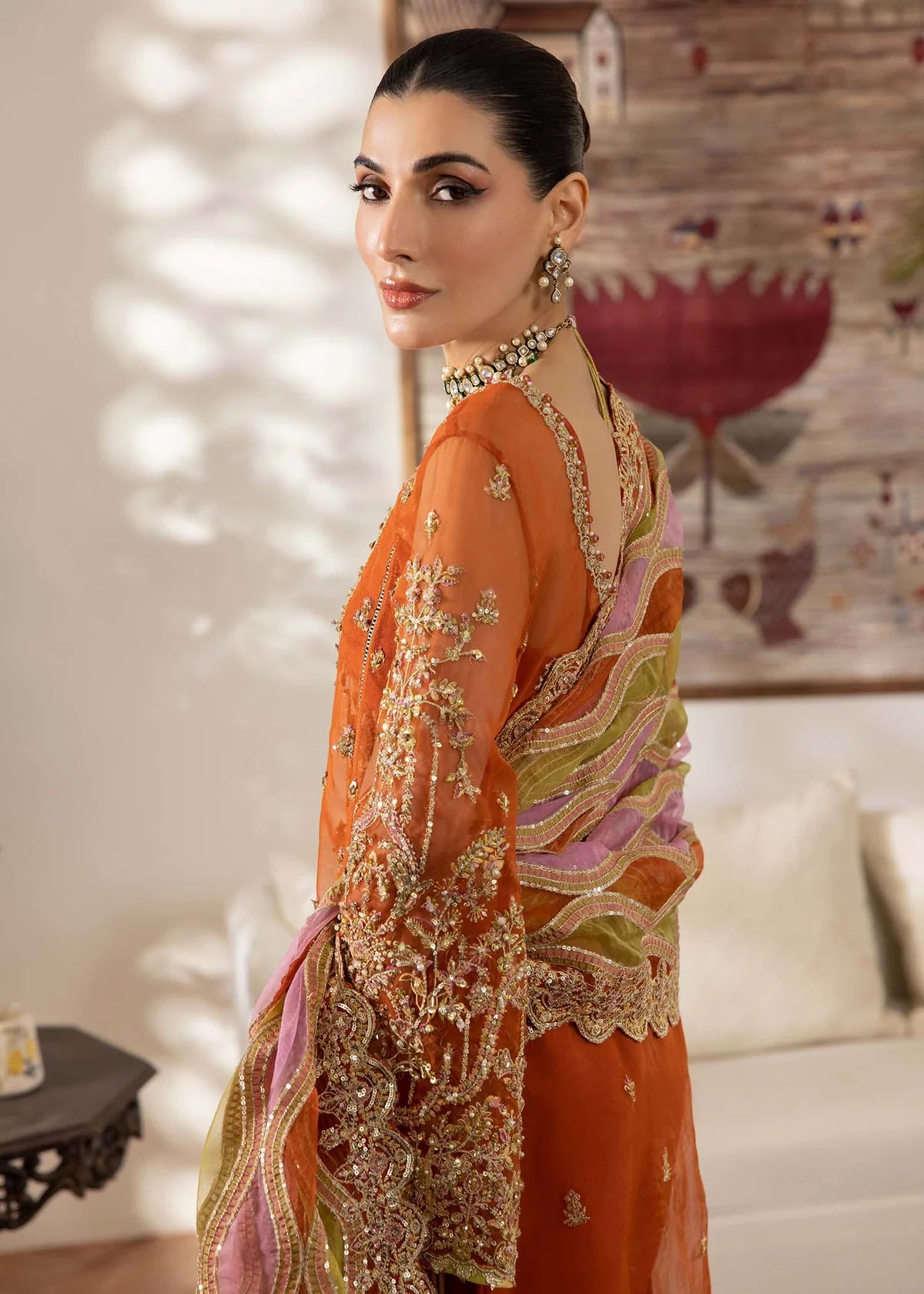 Model wearing burnt orange Roshail dress by Kanwal Malik with detailed embroidery—Pakistani luxury pret available online in UK.