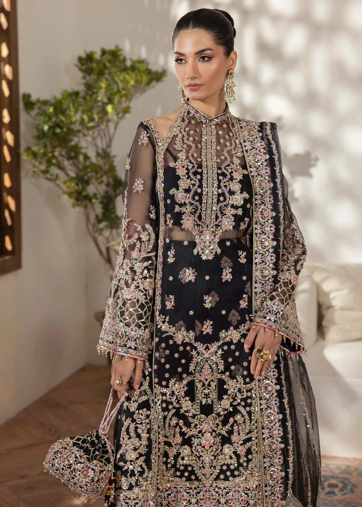 Model wearing black Rama outfit from Kanwal Malik with intricate embroidery—Pakistani luxury pret available online in UK.