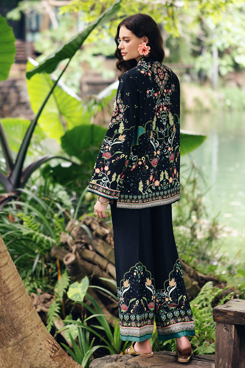 Model wearing OP-07 Rane, three-quarter view, a Pakistani designer outfit by Qalamkar, available online in the UK.