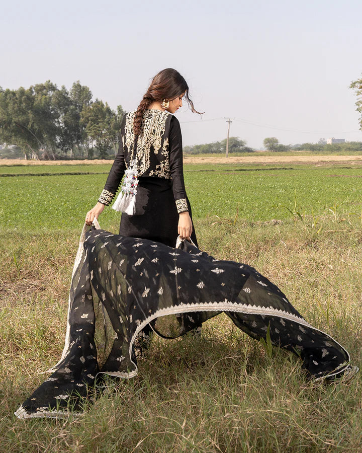 model wearing black dress by Faiza Saqlain, Pakistani luxury pret available online in UK for elegant Pakistani fashion