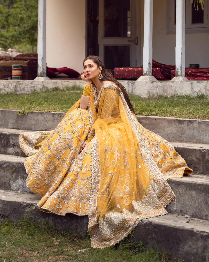 model wearing yellow dress by Faiza Saqlain, Pakistani luxury pret, ideal for online shopping in the UK
