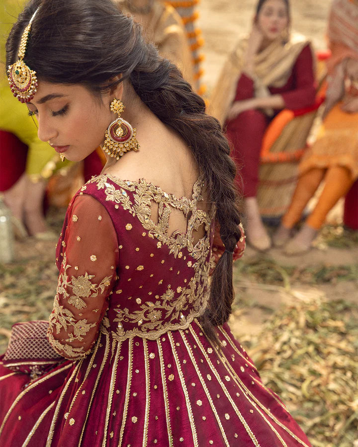 model wearing maroon dress by Faiza Saqlain, Pakistani luxury pret available online in UK for elegant festive wear