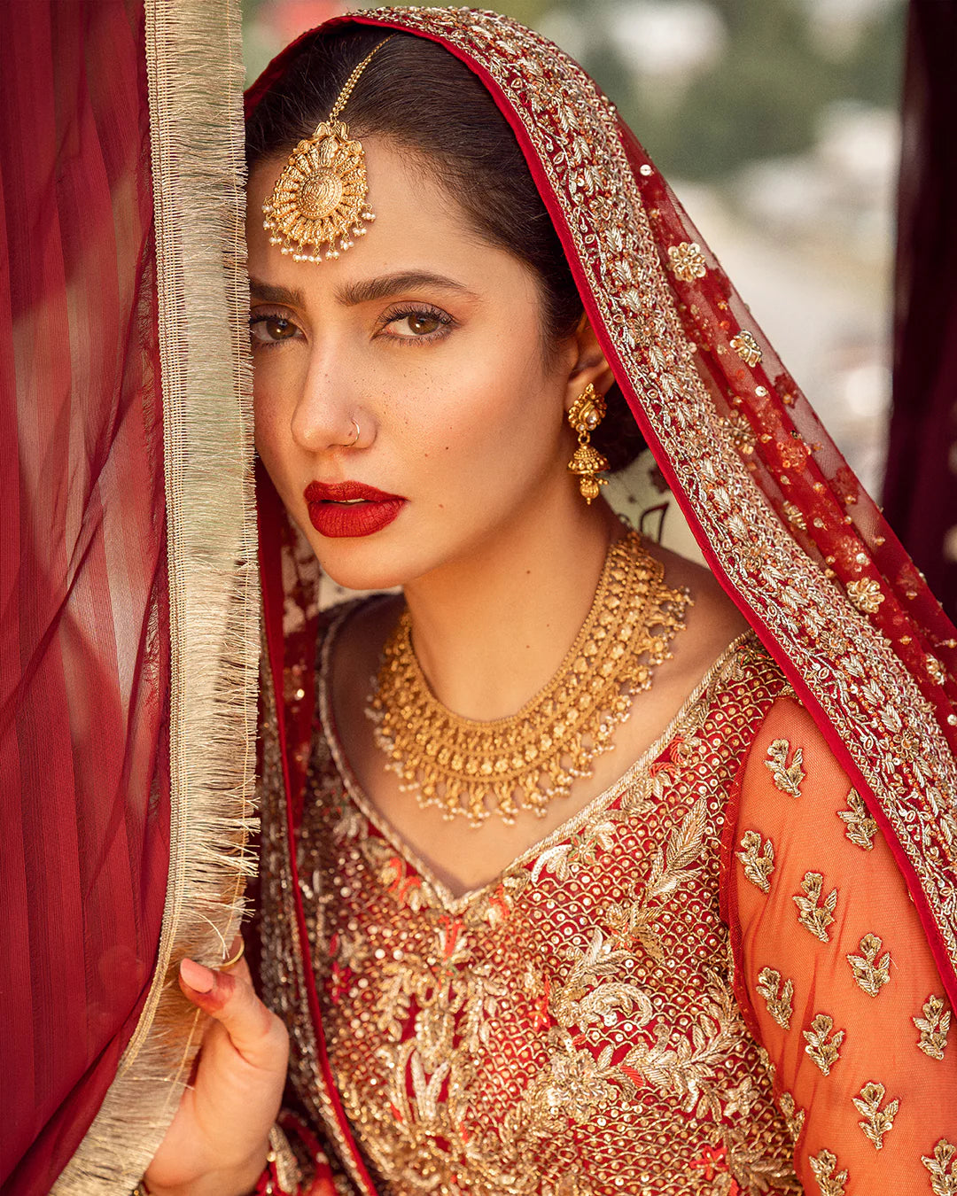model wearing red dress by Faiza Saqlain, Pakistani luxury pret ideal for online shopping in the UK