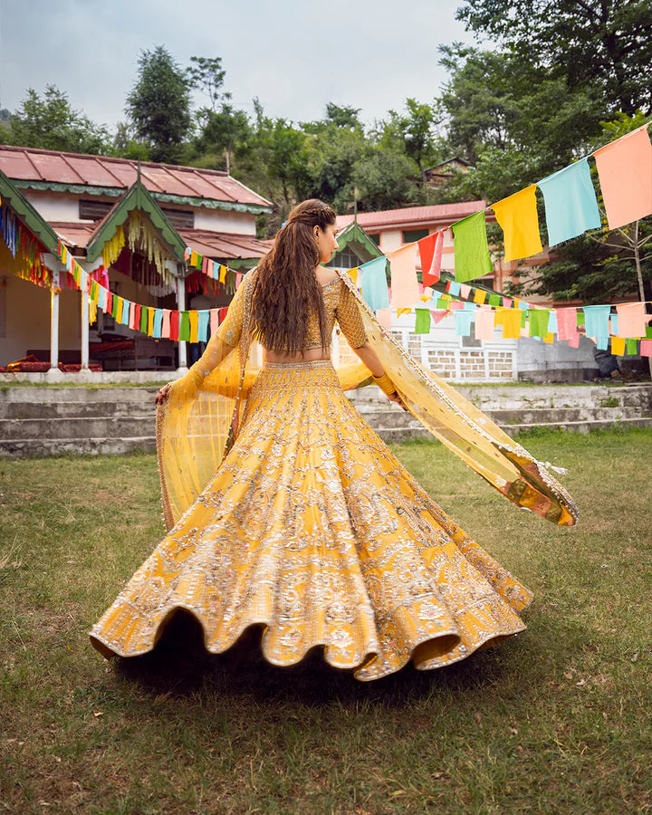 model wearing yellow dress by Faiza Saqlain, Pakistani luxury pret, ideal for online shopping in the UK