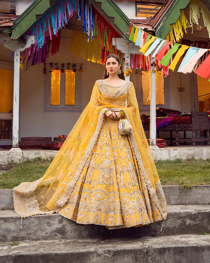model wearing yellow dress by Faiza Saqlain, Pakistani luxury pret, ideal for online shopping in the UK