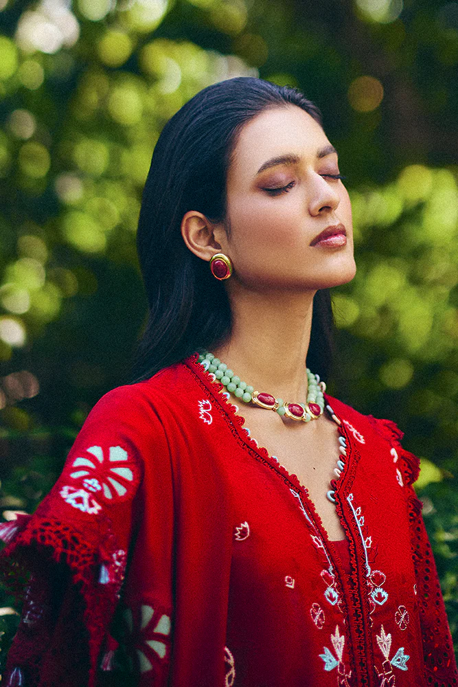 Model wearing deep red embroidered dress from Suffuse Casual Pret 2025 Crimsal. Pakistani luxury pret and Pakistani clothes online in UK.
