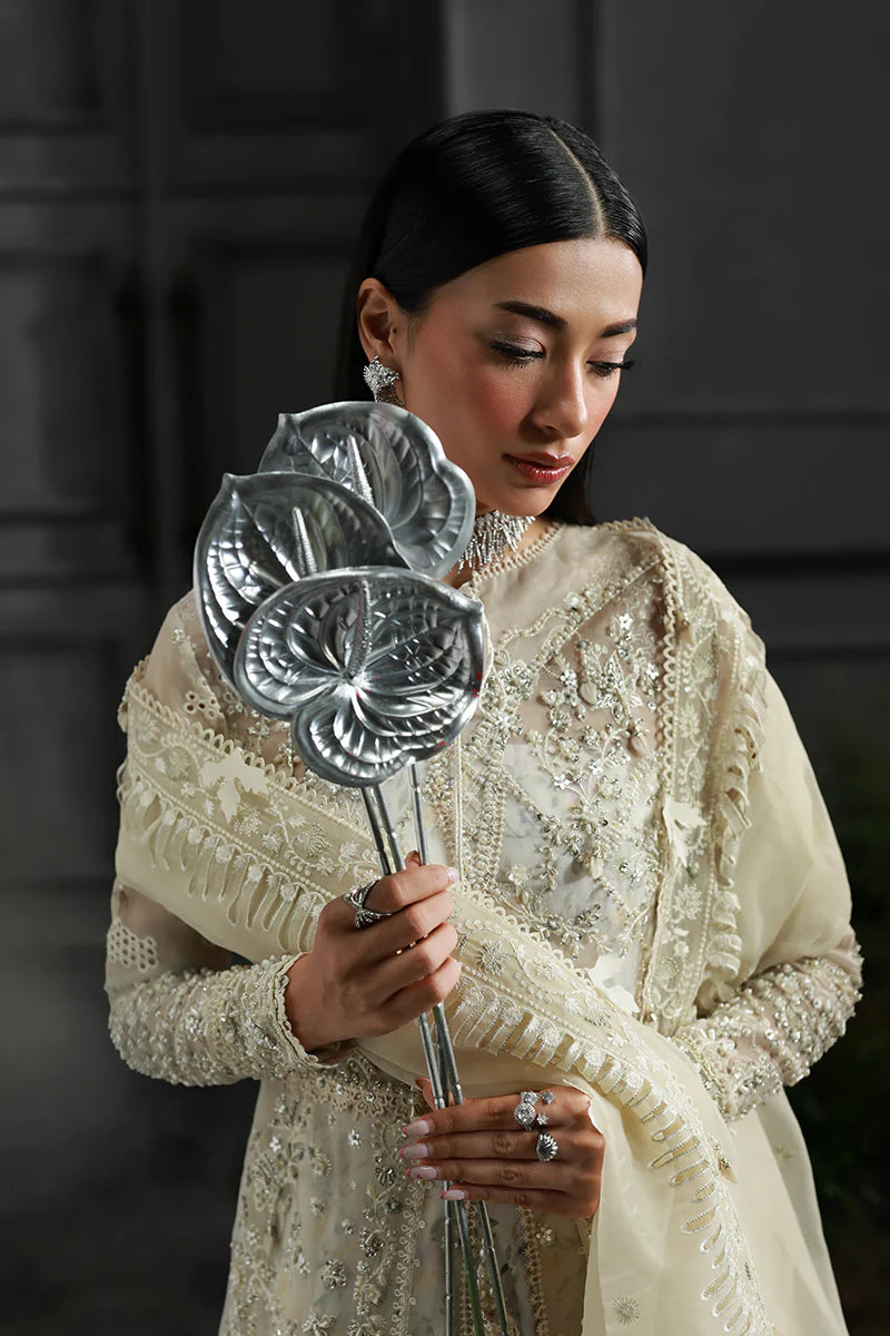 Model wearing MF-06 Ivara by Qalamkar in ivory hand-embroidered dress – Pakistani luxury pret perfect for festive wear, shop online in UK.