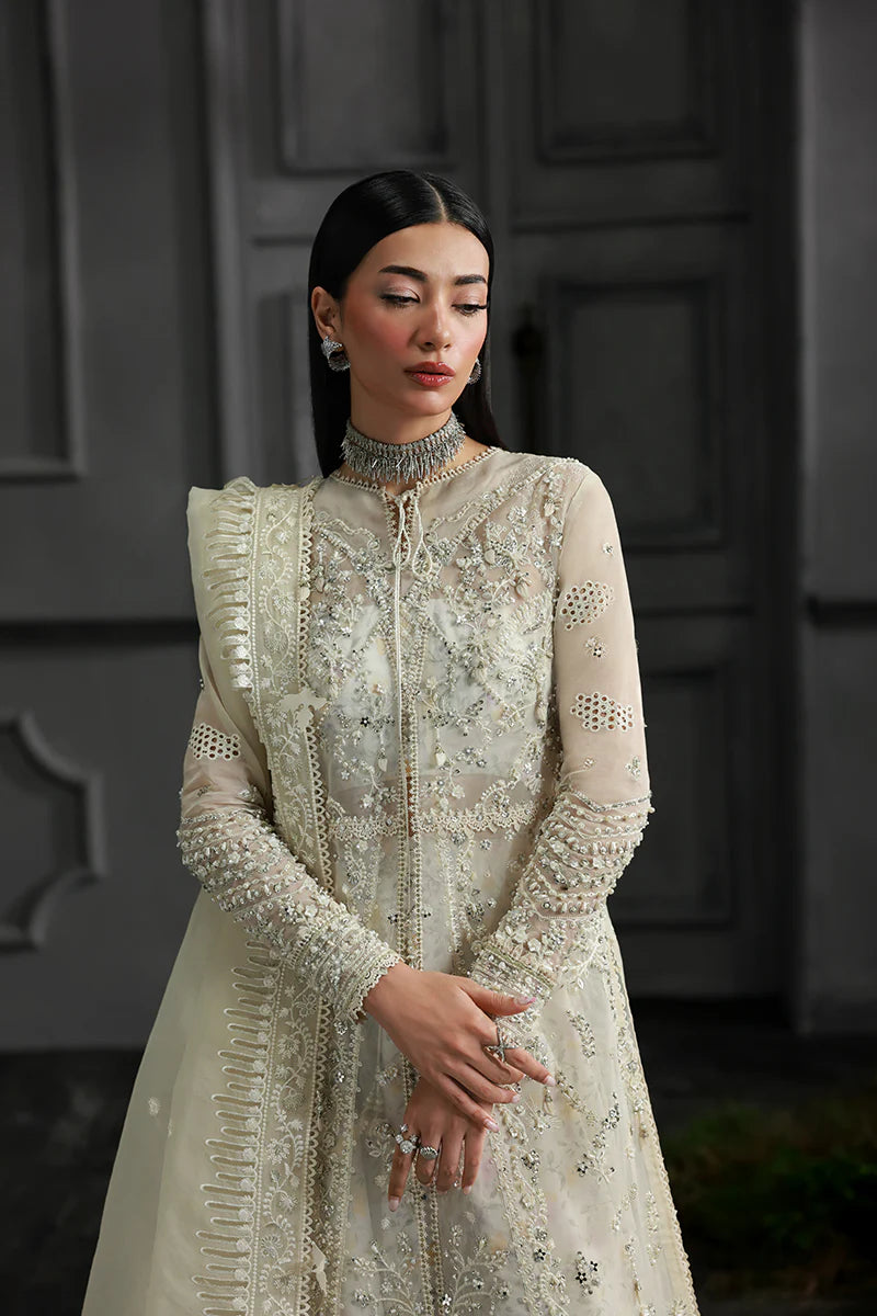 Model wearing MF-06 Ivara by Qalamkar in ivory hand-embroidered dress – Pakistani luxury pret perfect for festive wear, shop online in UK.