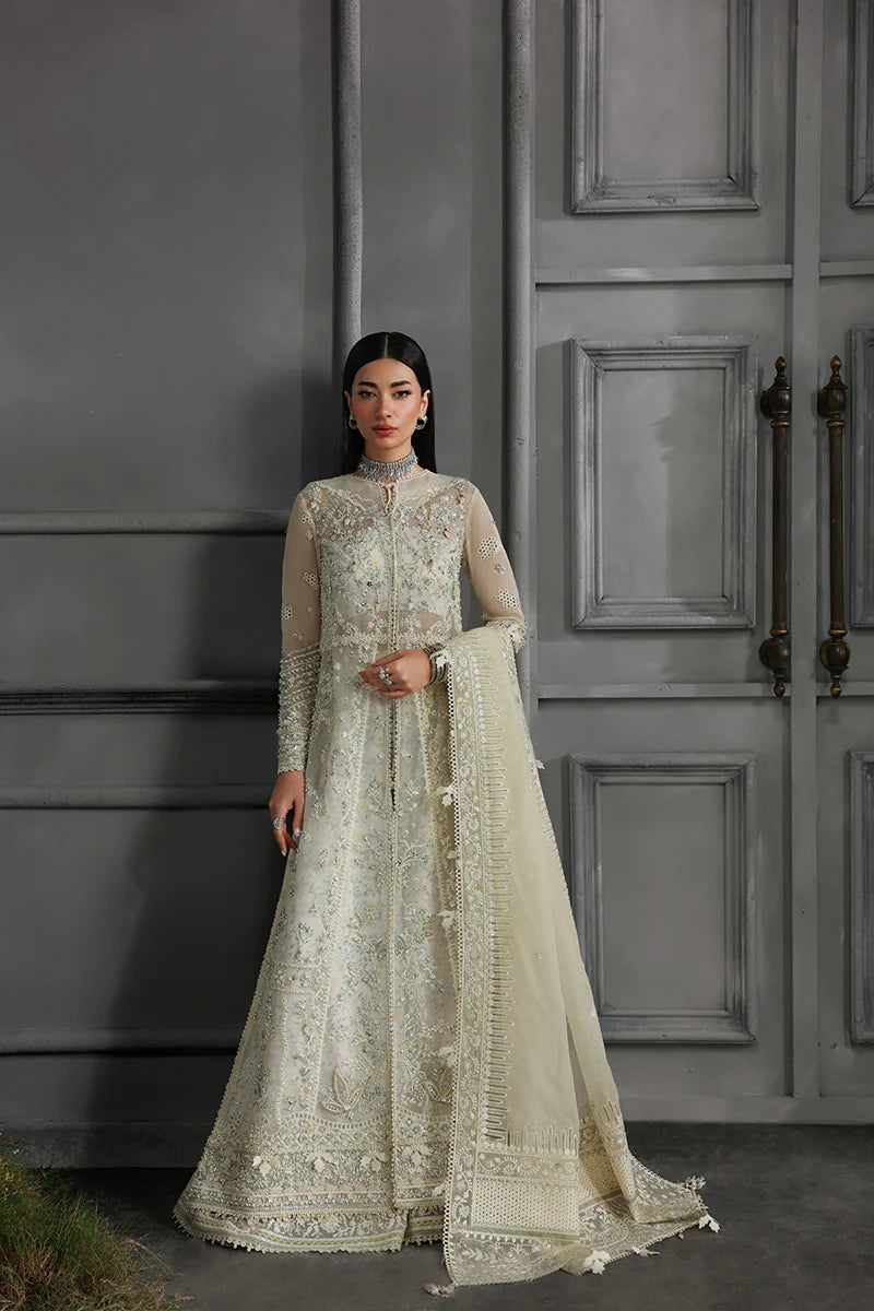 Model wearing MF-06 Ivara by Qalamkar in ivory hand-embroidered dress – Pakistani luxury pret perfect for festive wear, shop online in UK.