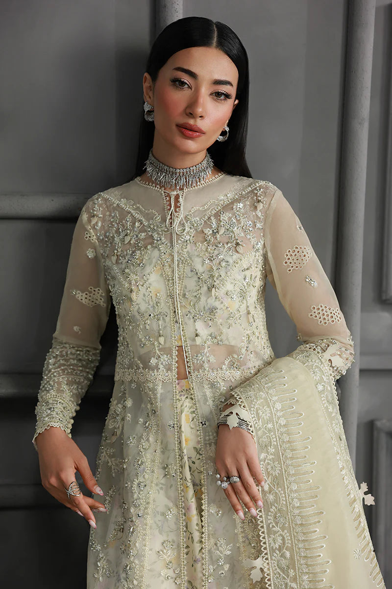 Model wearing MF-06 Ivara by Qalamkar in ivory hand-embroidered dress – Pakistani luxury pret perfect for festive wear, shop online in UK.
