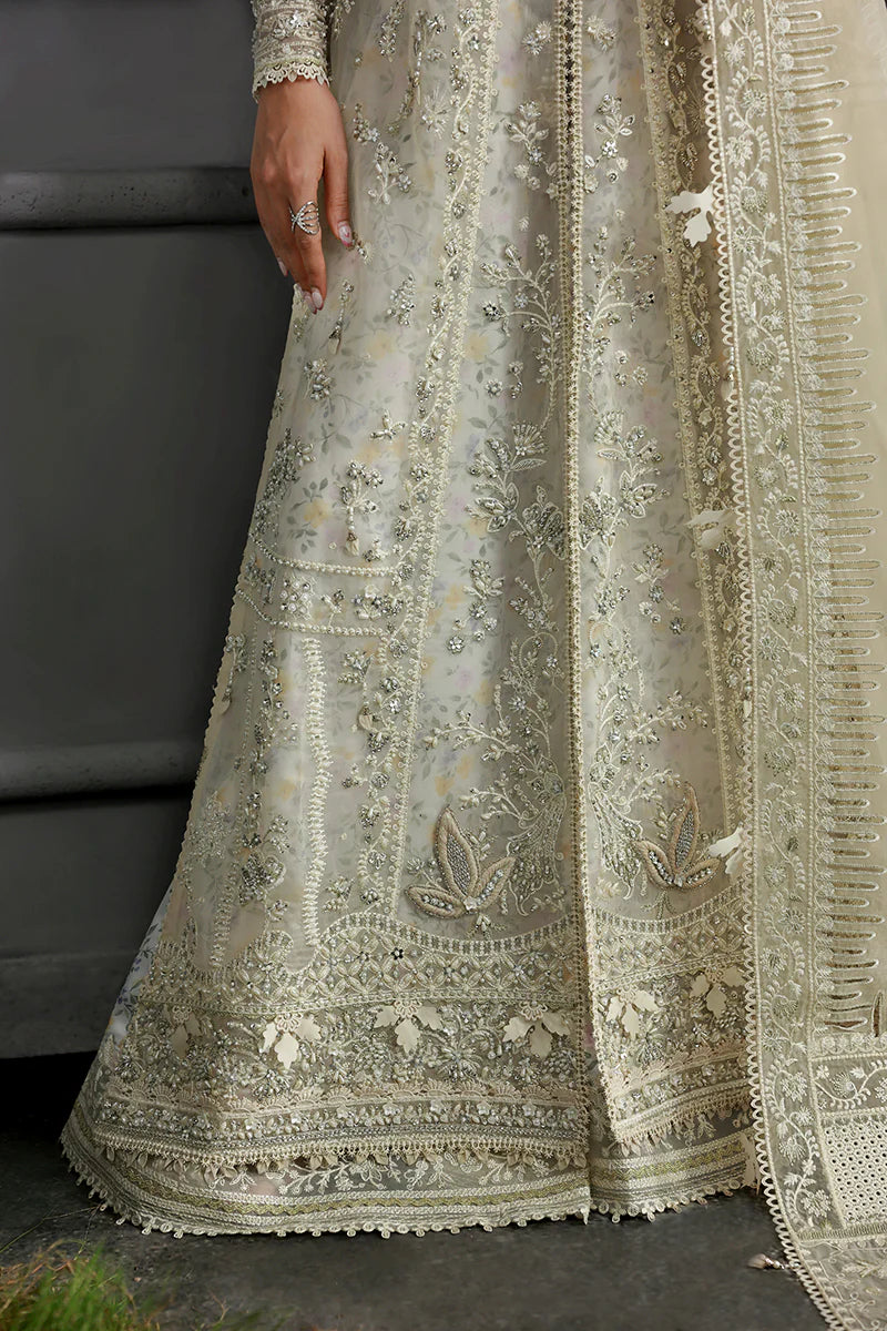 Model wearing MF-06 Ivara by Qalamkar in ivory hand-embroidered dress – Pakistani luxury pret perfect for festive wear, shop online in UK.