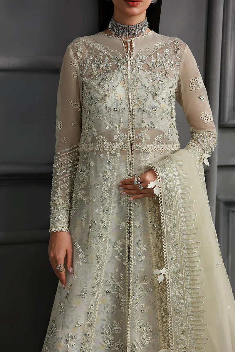 Model wearing MF-06 Ivara by Qalamkar in ivory hand-embroidered dress – Pakistani luxury pret perfect for festive wear, shop online in UK.