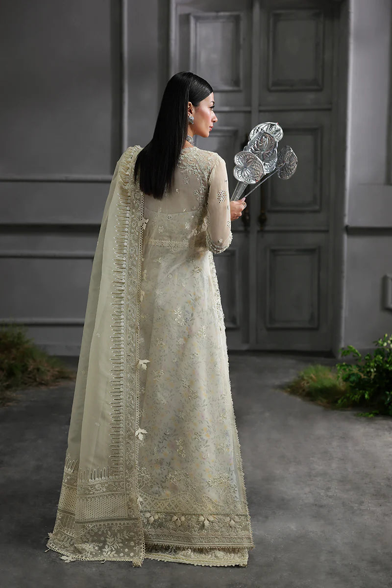 Model wearing MF-06 Ivara by Qalamkar in ivory hand-embroidered dress – Pakistani luxury pret perfect for festive wear, shop online in UK.