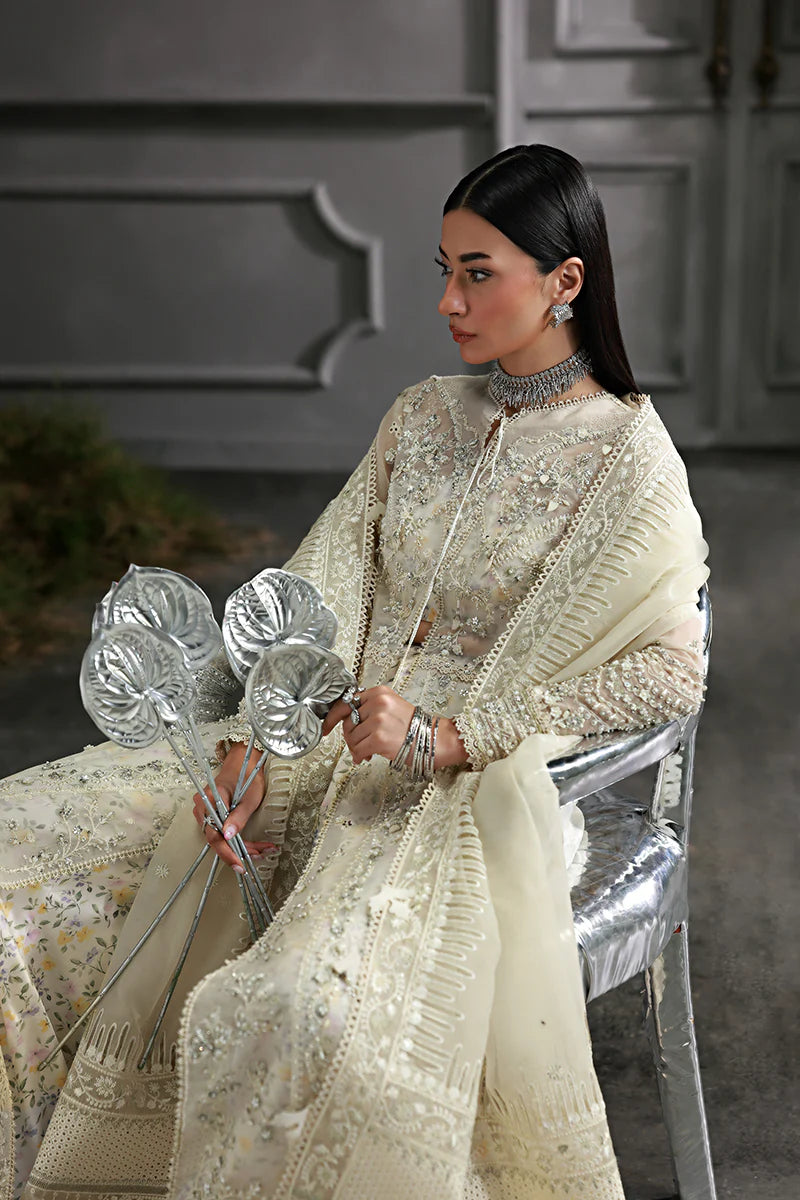 Model wearing MF-06 Ivara by Qalamkar in ivory hand-embroidered dress – Pakistani luxury pret perfect for festive wear, shop online in UK.