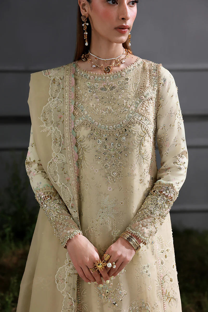 Model wearing MF-04 Ivory Grace by Qalamkar in ivory hand-embellished dress – Pakistani luxury pret perfect for festive wear, shop online in UK.