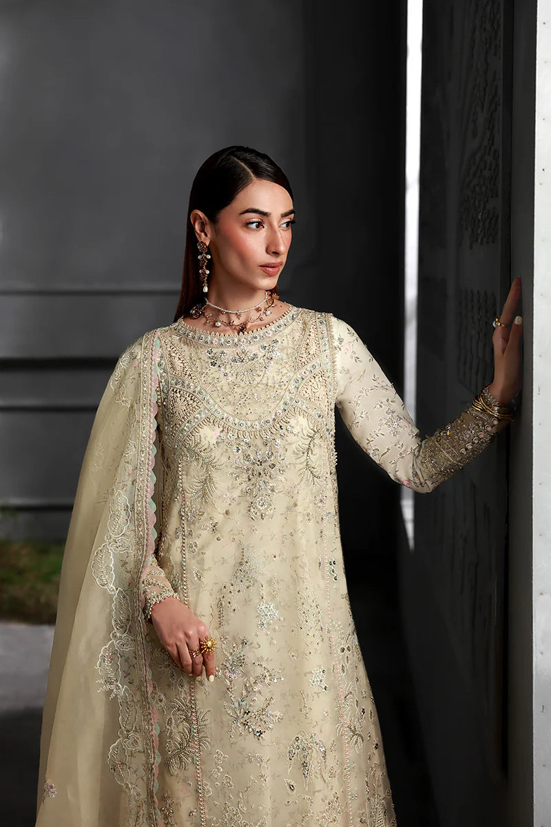 Model wearing MF-04 Ivory Grace by Qalamkar in ivory hand-embellished dress – Pakistani luxury pret perfect for festive wear, shop online in UK.