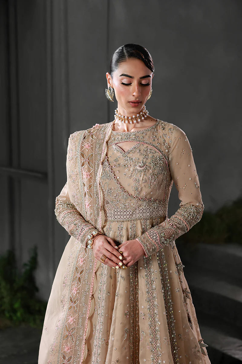Model wearing MF-01 Lustra by Qalamkar in peach pink hand-embellished dress – Pakistani luxury pret perfect for festive wear, shop online in UK.