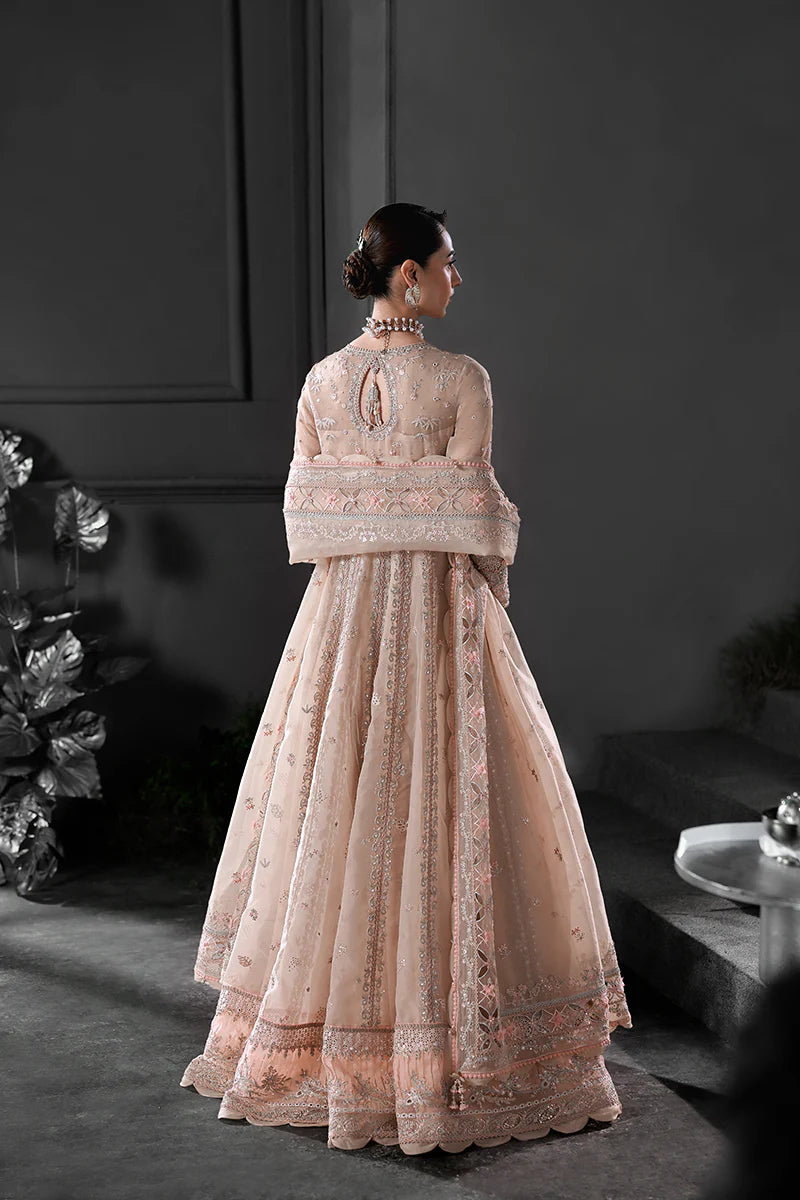 Model wearing MF-01 Lustra by Qalamkar in peach pink hand-embellished dress – Pakistani luxury pret perfect for festive wear, shop online in UK.