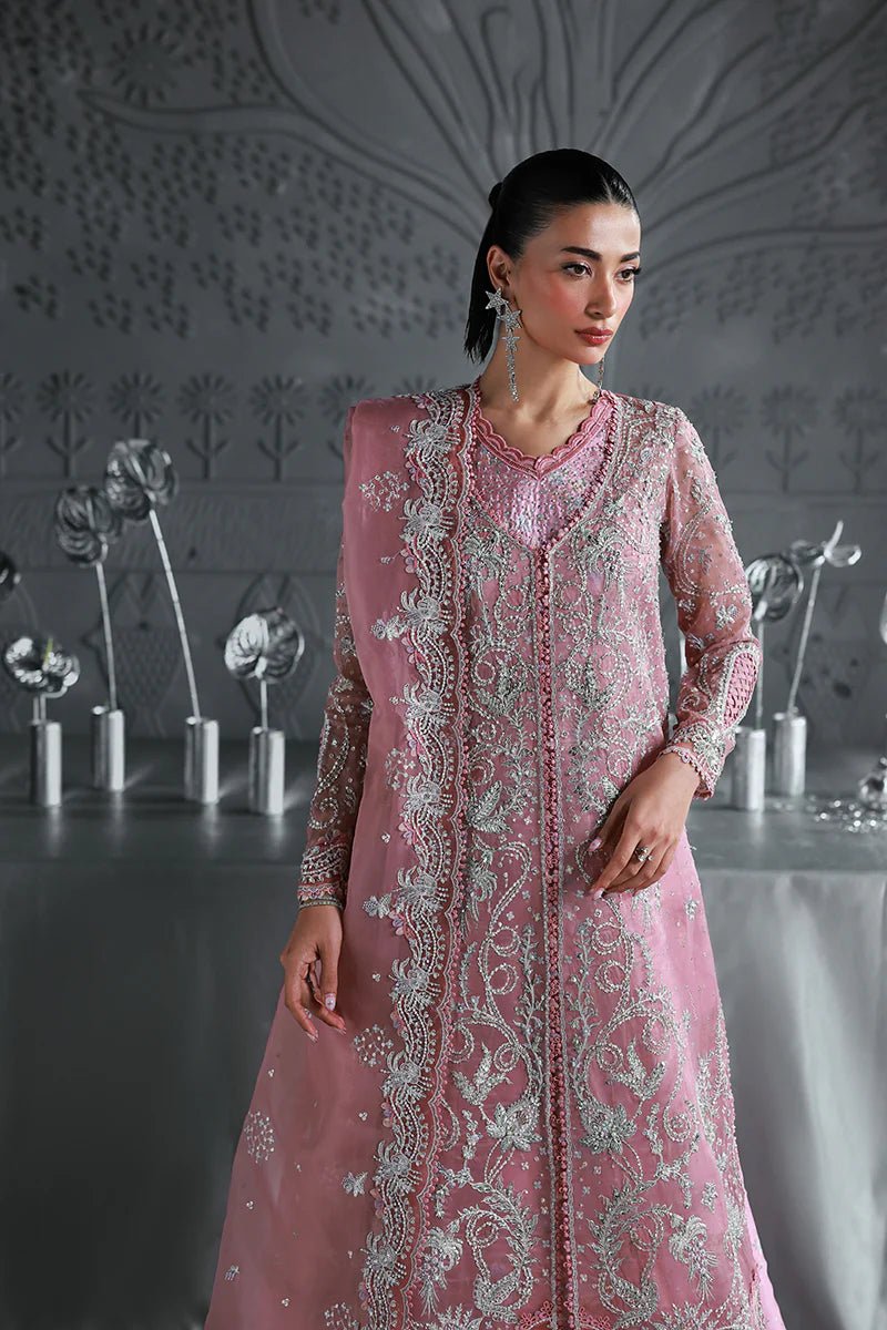 Model wearing MF-07 Rosalyn by Qalamkar in rose pink hand-embroidered dress – Pakistani luxury pret perfect for festive wear, shop online in UK.
