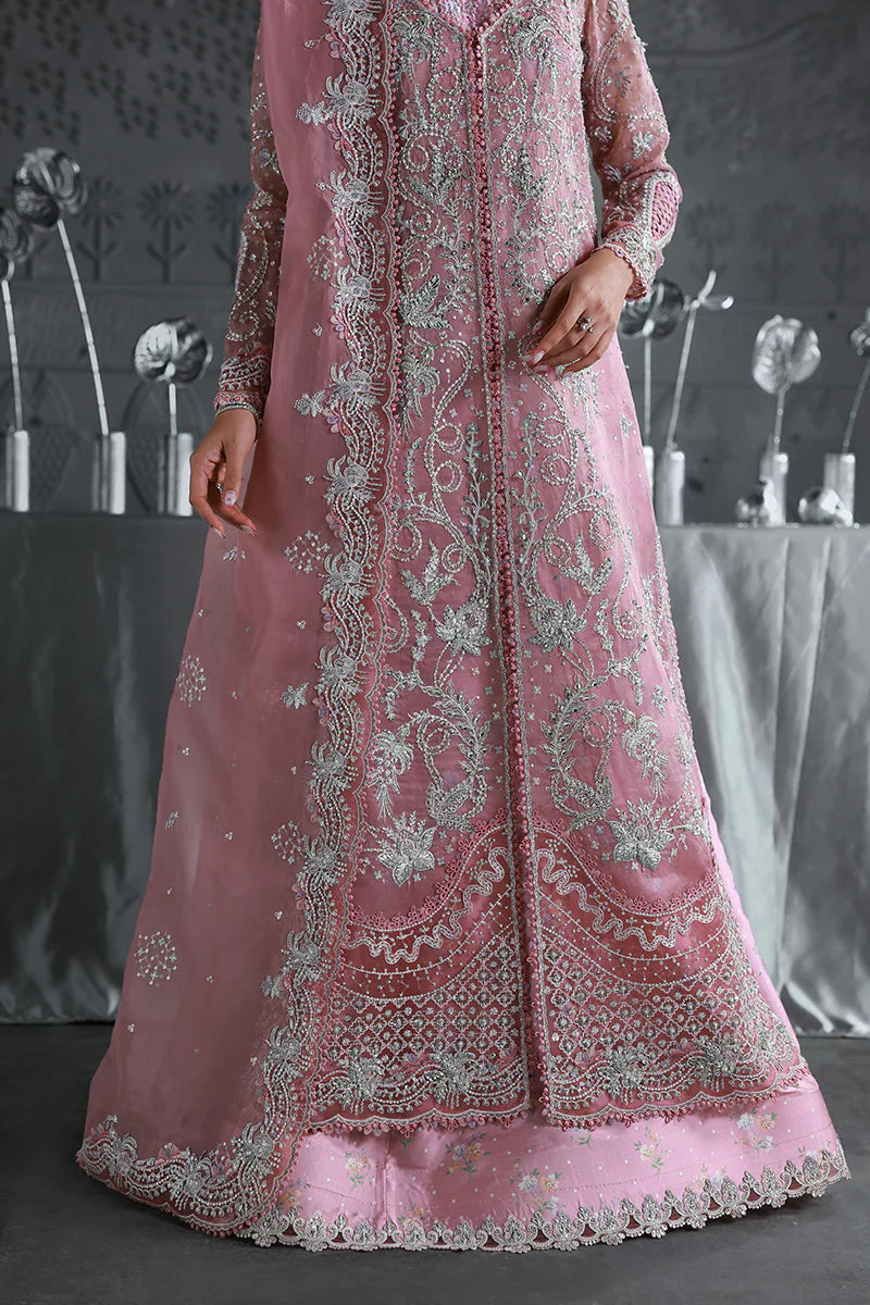 Model wearing MF-07 Rosalyn by Qalamkar in rose pink hand-embroidered dress – Pakistani luxury pret perfect for festive wear, shop online in UK.