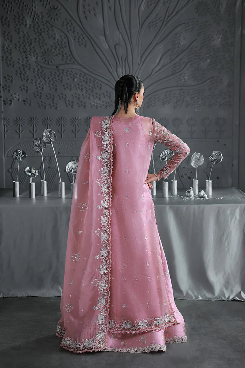 Model wearing MF-07 Rosalyn by Qalamkar in rose pink hand-embroidered dress – Pakistani luxury pret perfect for festive wear, shop online in UK.