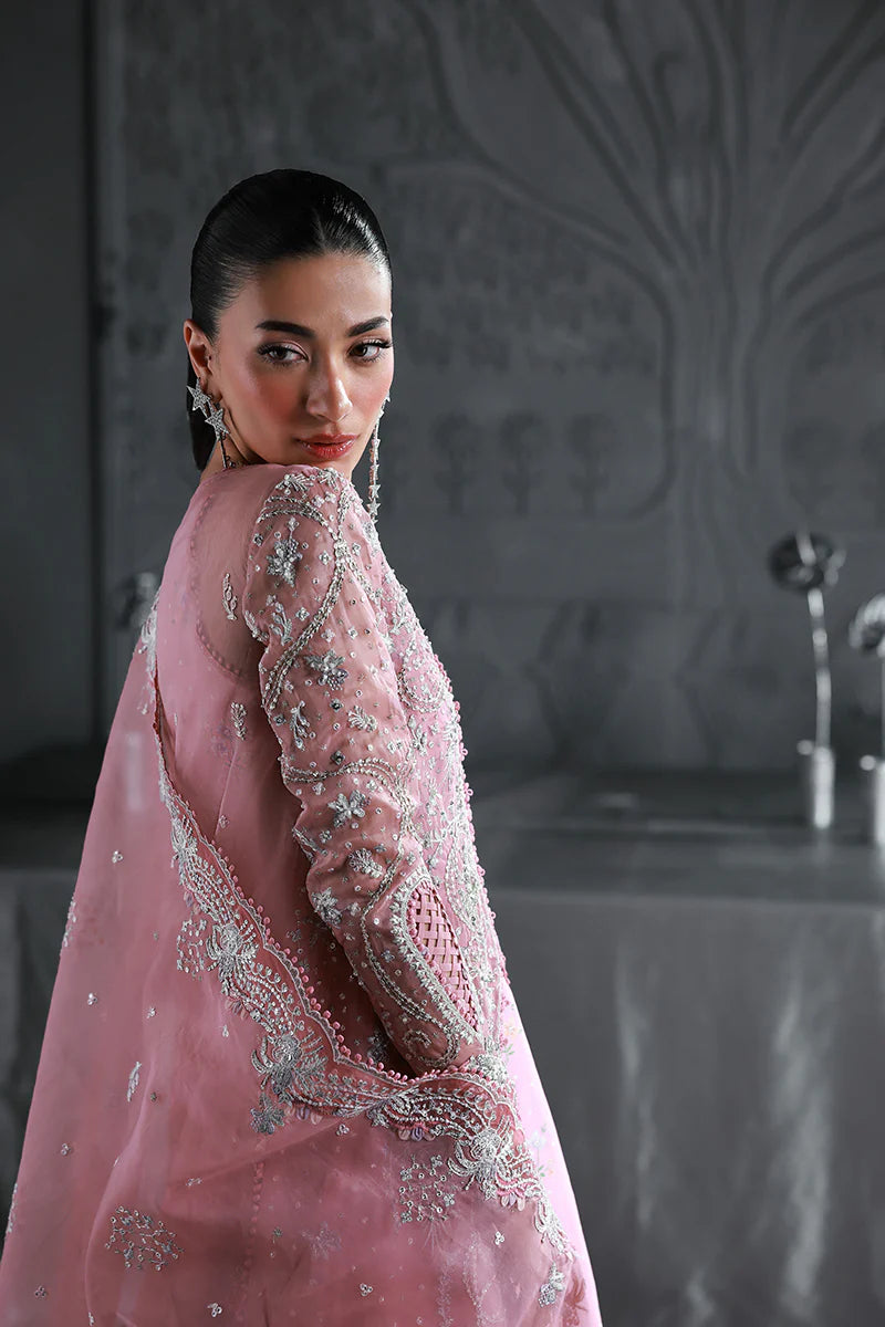 Model wearing MF-07 Rosalyn by Qalamkar in rose pink hand-embroidered dress – Pakistani luxury pret perfect for festive wear, shop online in UK.