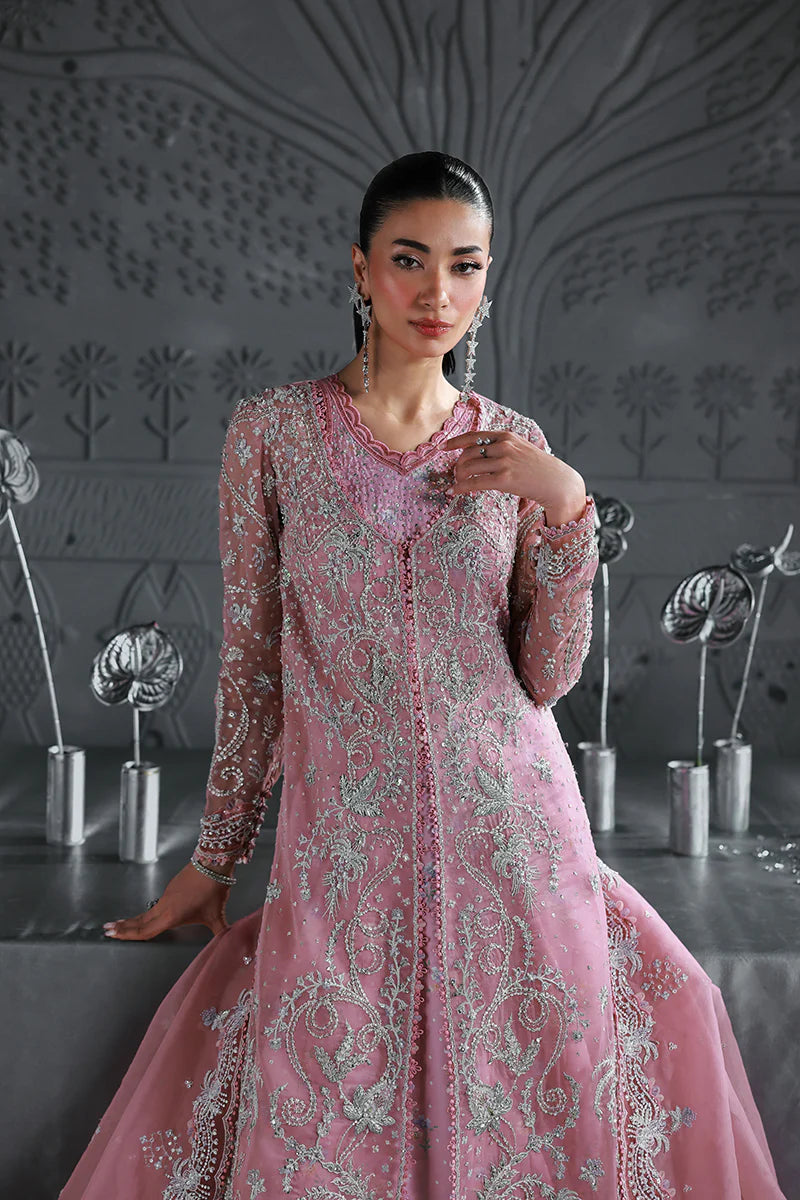 Model wearing MF-07 Rosalyn by Qalamkar in rose pink hand-embroidered dress – Pakistani luxury pret perfect for festive wear, shop online in UK.