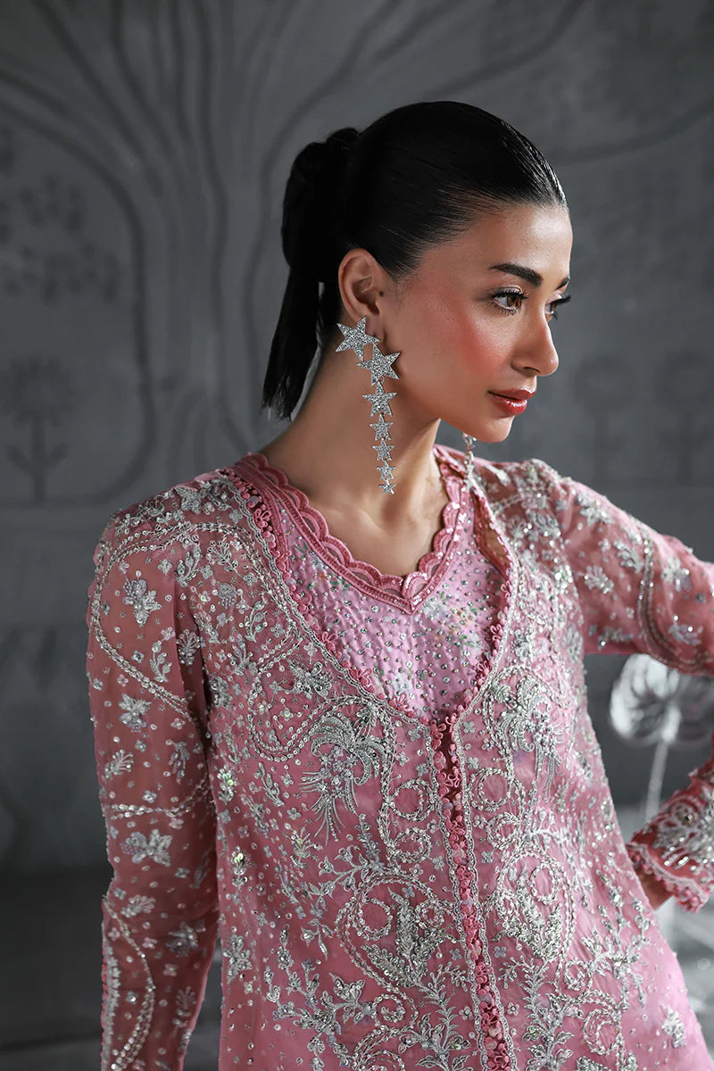 Model wearing MF-07 Rosalyn by Qalamkar in rose pink hand-embroidered dress – Pakistani luxury pret perfect for festive wear, shop online in UK.