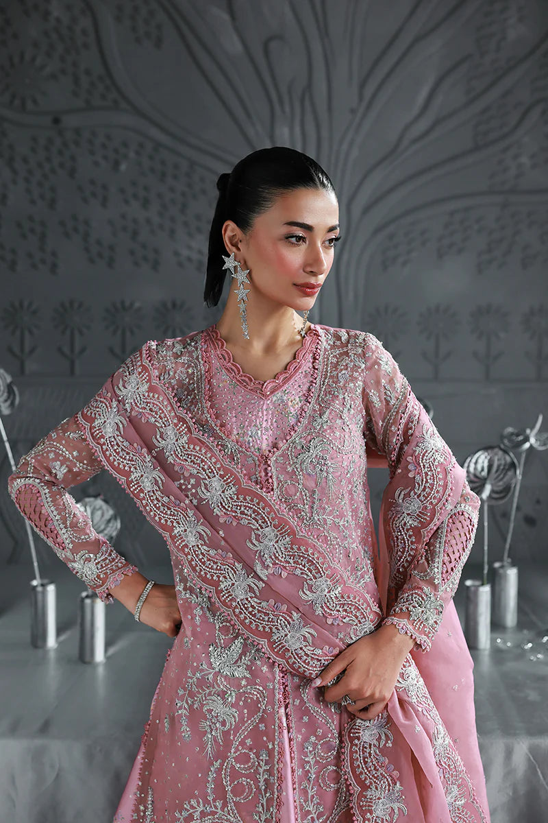 Model wearing MF-07 Rosalyn by Qalamkar in rose pink hand-embroidered dress – Pakistani luxury pret perfect for festive wear, shop online in UK.