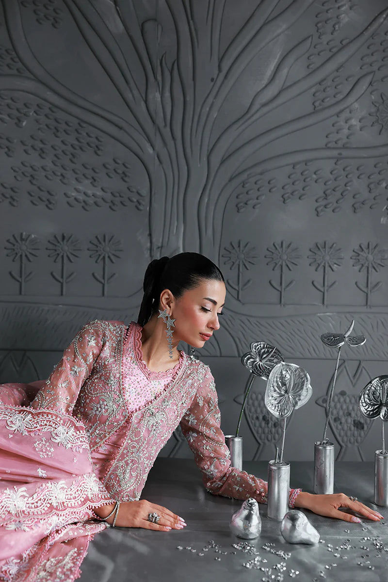 Model wearing MF-07 Rosalyn by Qalamkar in rose pink hand-embroidered dress – Pakistani luxury pret perfect for festive wear, shop online in UK.